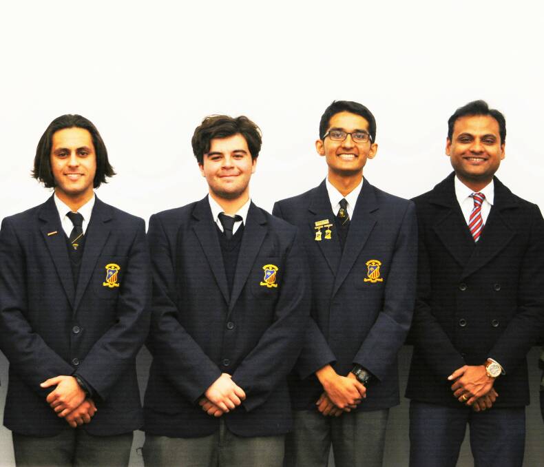 STUDENTS GENEROSITY: Ali Ridha, Haider Ali, James Joseph and science teacher Jose Sonny. Photo: TAYLOR DODGE.