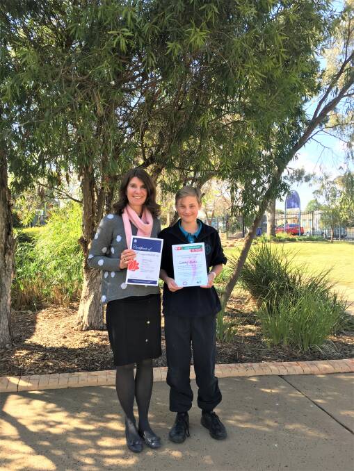 LOUD AND PROUD: Orana Heights Public School principal Annie Munro and year six student Corey Binks. Photo: TAYLOR DODGE. 