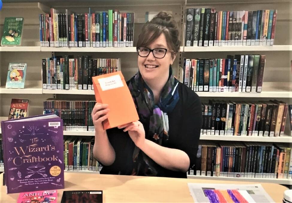 GETTING CRAFTY: Macquarie Regional Library Dubbo branch staff member Sarah Tillbrook with the very first activity pack. Photo: CONTRIBUTED. 