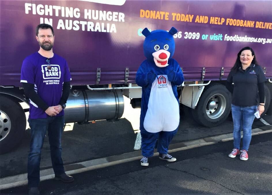 WE CARE: School Breakfast 4 Health and Agencies team leader Adam Loftus with Harry the homeless bear and Dubbo Neighbourhood Centre chief executive officer Michelle Redden. Photo: TAYLOR DODGE. 