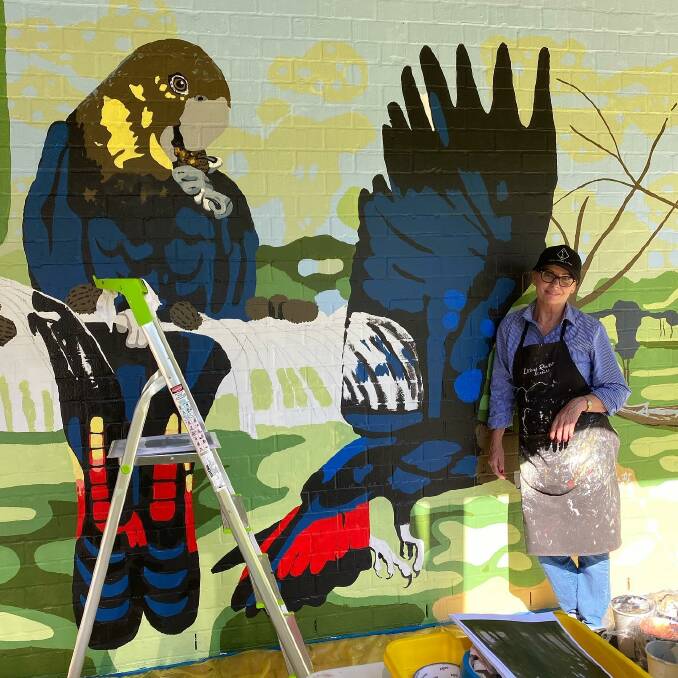 SIGHT TO SEE: The Studio Shed Dubbo artist Gillian Pedrana working on threatened species mural at the Dubbo Visitors Information Centre. Photo: CONTRIBUTED.