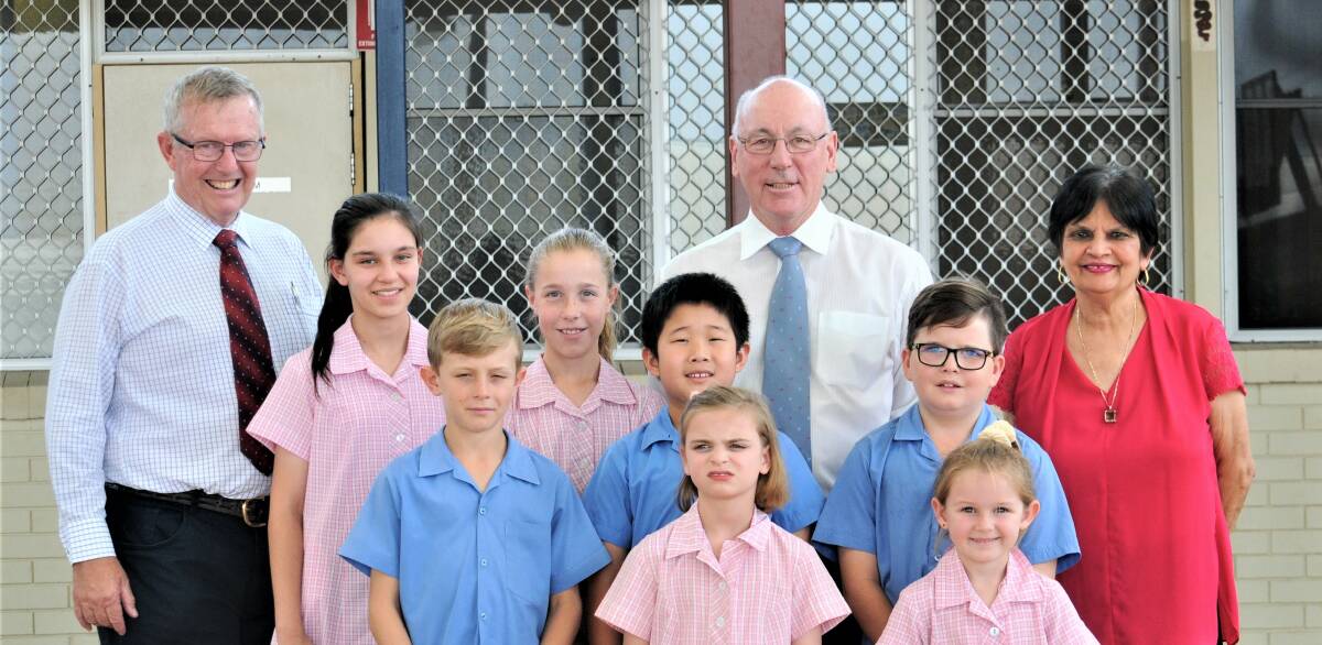 HAPPY: St Pius X Catholic Primary School students with Mark Coulton MP, Father Greg Kennedy and School principal Heather Irwin. Photo: TAYLOR DODGE.