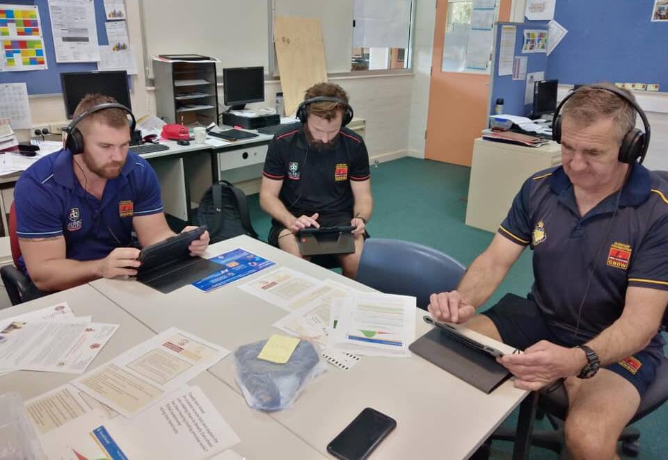 EAR EDUCATION: Dubbo College Clontarf members using the Sound Scouts device. Photo: CONTRIBUTED. 