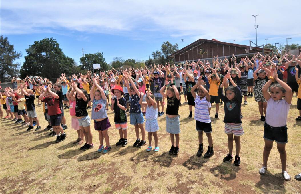 DANCING FOR RAIN: Dubbo North Public students took part in a nationwide dance to "Bust the Dust". Photo: TAYLOR DODGE.