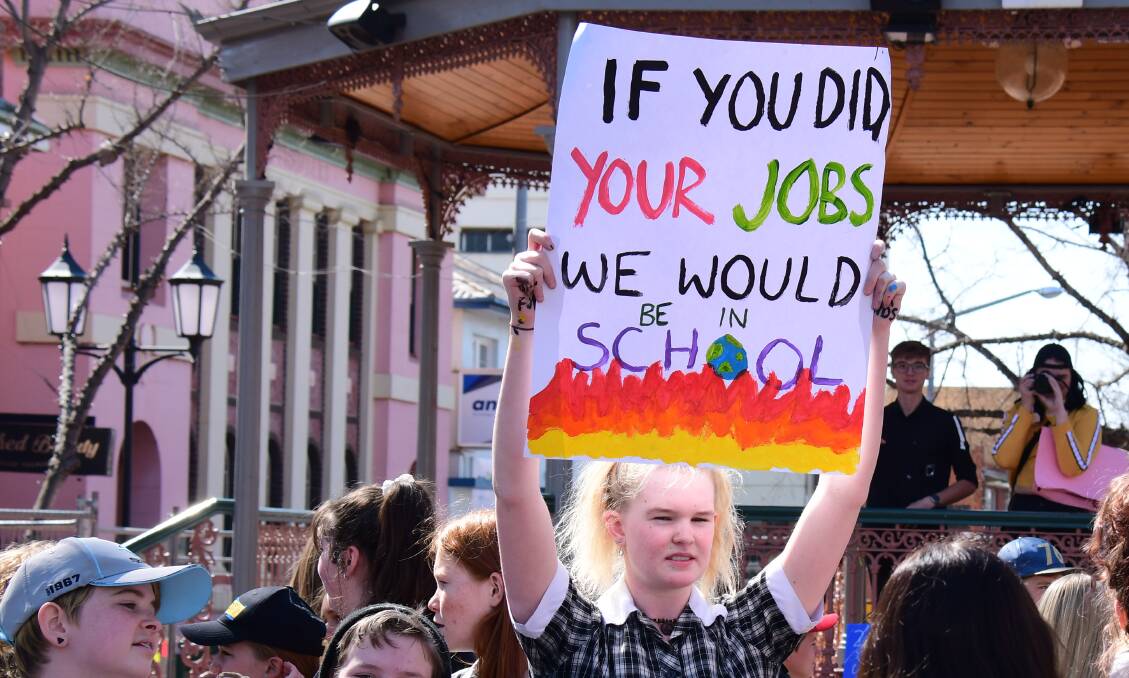 ACTION: School Strike for Climate 2019 protester. Photo: AMY McINTYRE. 