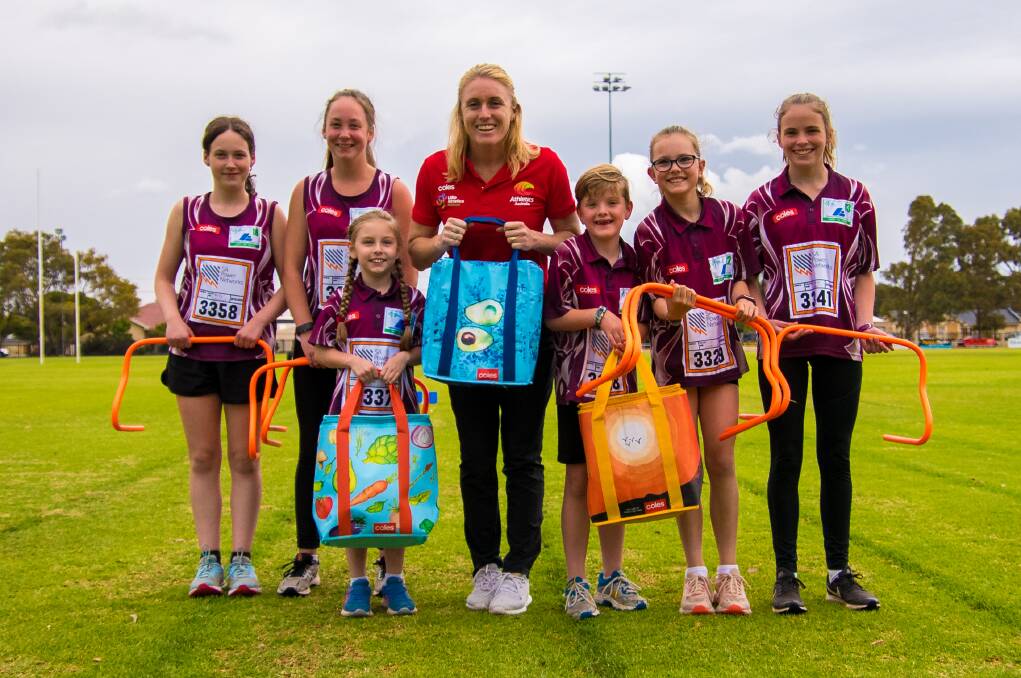 GOODIES: Sally Pearson and Little Athletes with the Coles Community Bags that funds new sports equipment. Photo: CONTRIBUTED. 
