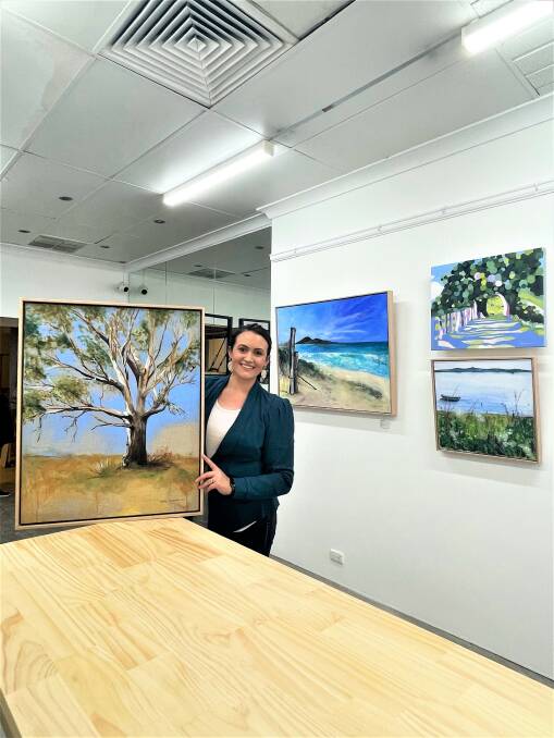 IT'S AN ART AFFAIR: Laura Dunkley from Creative Fusion with some of the pieces in store. Photo: TAYLOR DODGE. 