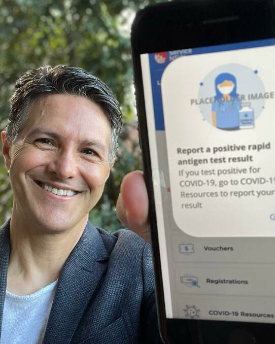 EASY ACCESS: NSW government Customer Service Minister Victor Dominello shows off how residents will soon be able to record their RAT results via the Service NSW app. Photo: FACEBOOK