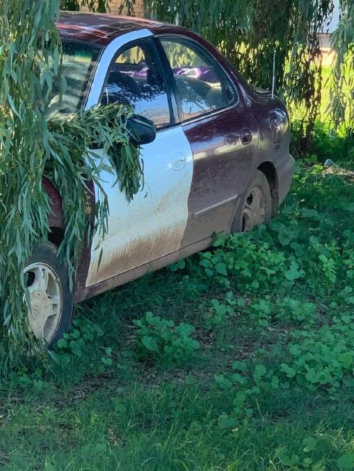 Officers pursued Lang through a number of residential streets in Nyngan reaching speeds of 110 km/h. This is the car discovered in a backyard in Wambiana Street in Nyngan. Photo: CONTRIBUTED