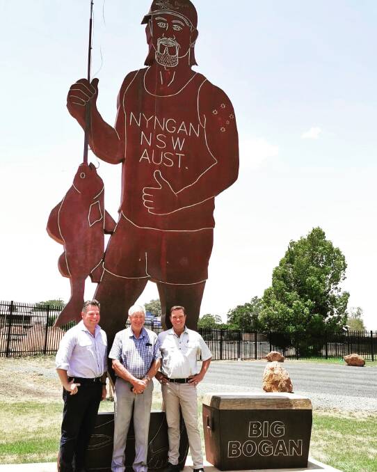 Member for Orange Phil Donato, Bogan Shire mayor Ray Donald and Barwon MP Roy Butler pose for a photo with the Big Bogan in Nyngan. Photo: CONTRIBUTED