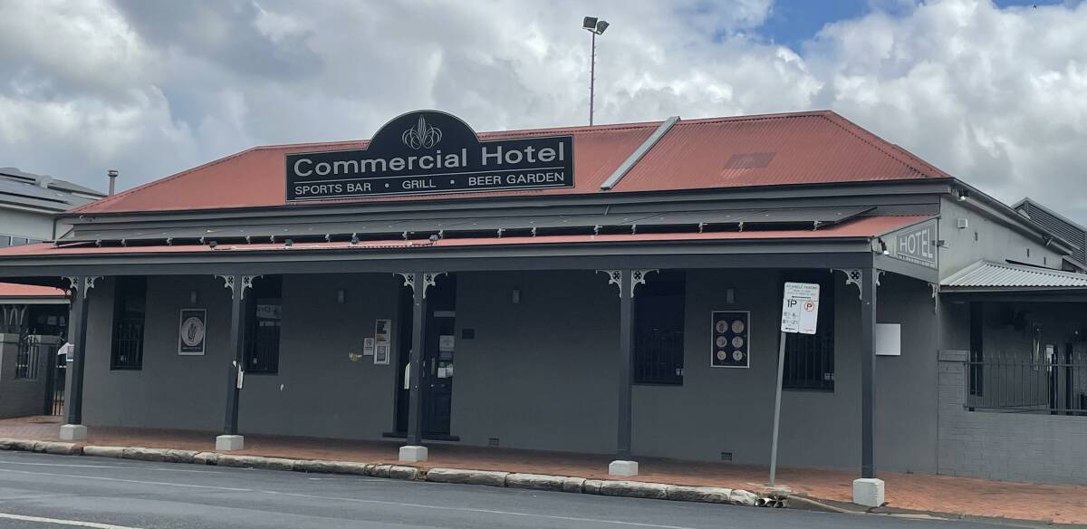 According to police, two officers entered the male bathroom at the Commercial Hotel when they immediately heard the sounds of 