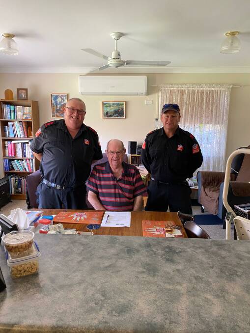 Narromine FRNSW captain Ewen Jones and retained firefighter Marc Barton with Jeff. Photo: CONTRIBUTED