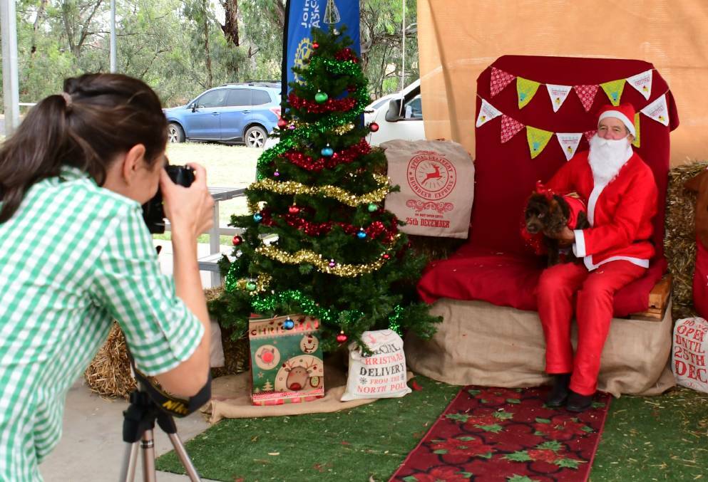 CHEESE: Sally Pittman behind the camera with Santa and Lacey in 2020. Photo: AMY McINTYRE