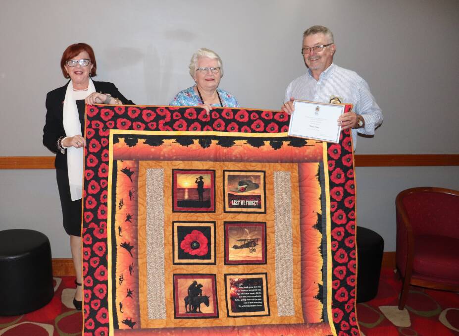 THANKS: State coordinator of RSL Auxiliaries Pauline James and Dubbo Auxiliary member Elizabeth Allen with recipient veteran and Dubbo RSL sub-branch president Tom Gray. Photo: ZAARKACHA MARLAN