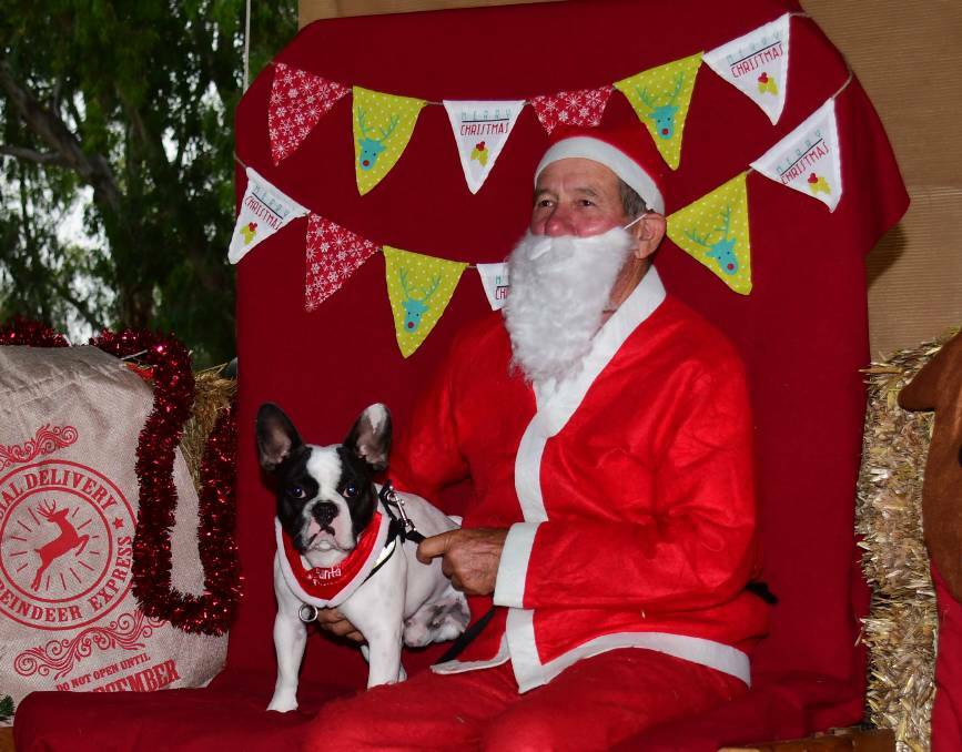 SMILE: Loui and Santa at the event in 2020. Photo: AMY McINTYRE