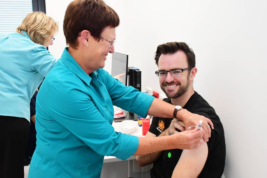 MILESTONE: Western NSW LHD nurse Wanda Davis delivers the first vaccine to Dr Dan Stewart. Photo: BELINDA SOOLE