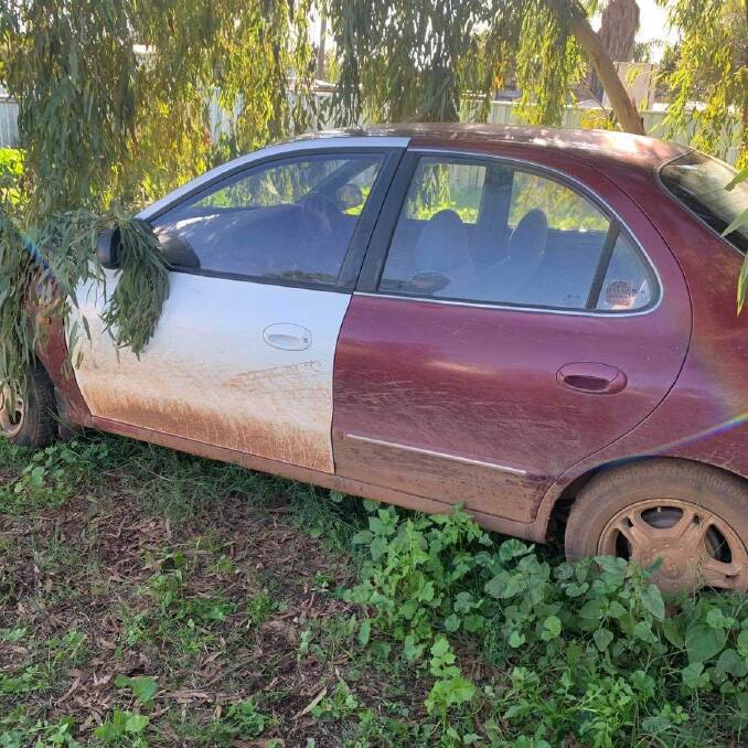 Officers pursued Lang through a number of residential streets in Nyngan reaching speeds of 110 km/h. This is the car discovered in a backyard in Wambiana Street in Nyngan. Photo: CONTRIBUTED