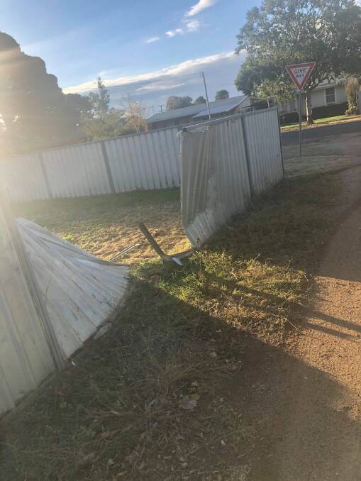 A pursuit was initiated throughout the township of Narromine before police allege the vehicle crashed into a residential fence on Minore Street. Photo: CONTRIBUTED