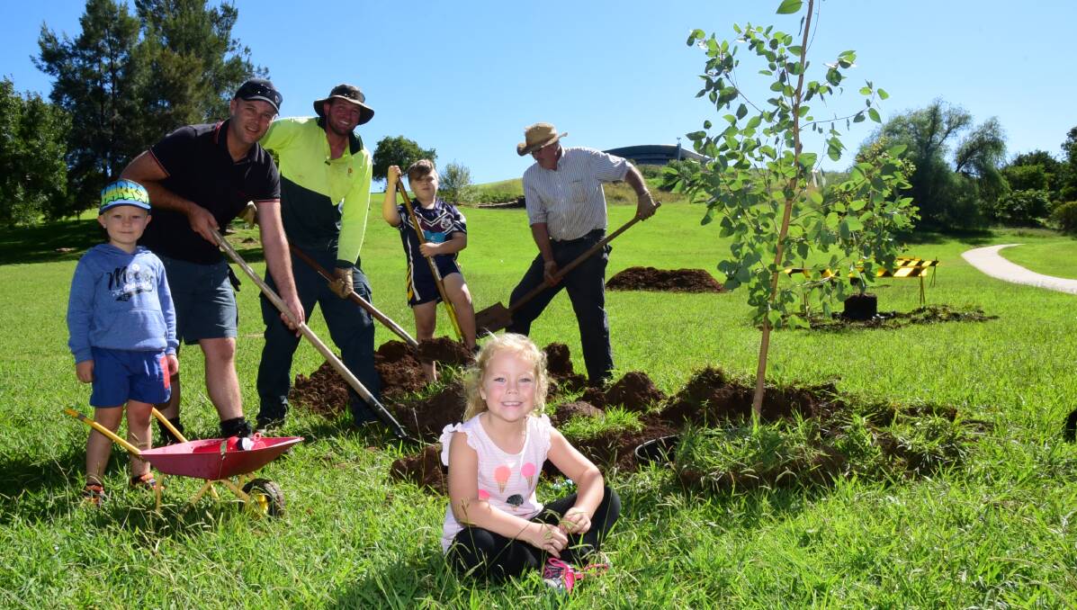 TREE PLANTING: Twenty young trees were planted along the Sir Roden Cutler Park walkway earlier this month. Photo: PAIGE WILLIAMS