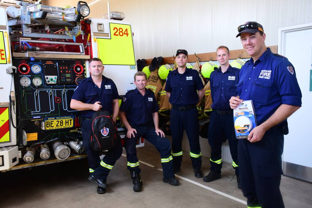 Friendly Firefighters: Sam Preston-Stanley, Joseph Bacon, John Koutsogiannis, Ryan Mackintosh and Delroy Fire Station captain Aaron Ferguson. PHOTO: AMY MCINTYRE.