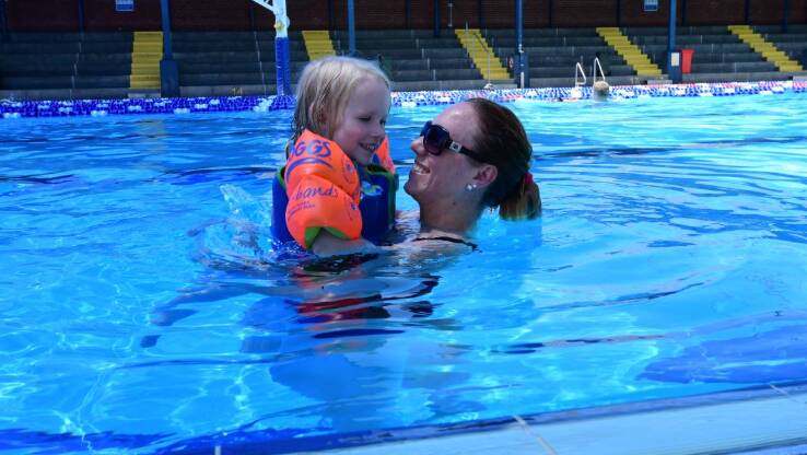 COOLING OFF: Faithlyn Trotter, 3, and her mother Kelly enjoy a dip at the Dubbo Aquatic Leisure Centre. Photo: BELINDA SOOLE