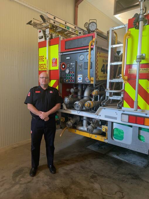 AWESOME EQUIPMENT: Commander Gary Barber with the Compressed Air Foam Tanker, based at Delroy Fire Station. PHOTO: SUPPLIED. 