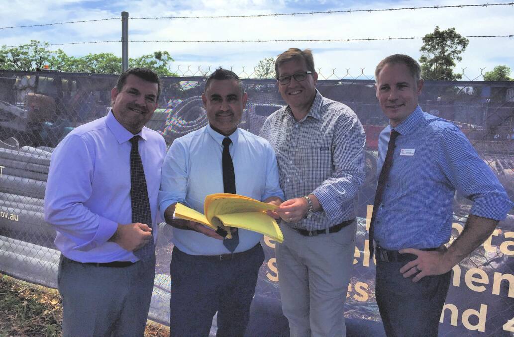Delivering: The National's Dugald Saunders, John Barilaro and Troy Grant with Western Health District chief executive Scott McLachlan. Photo: CRAIG THOMSON.