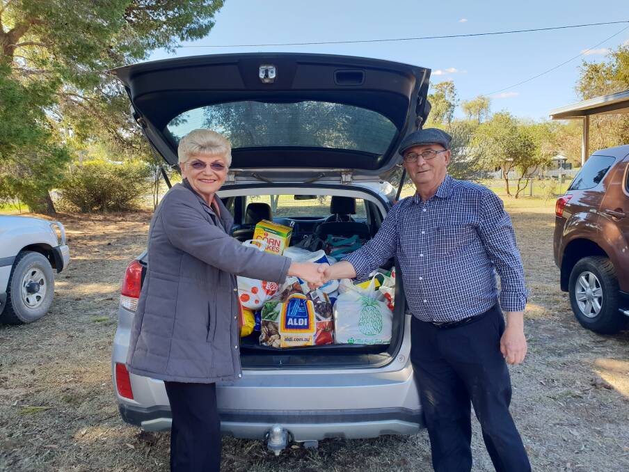 Cr Anne Jones accepting “Need for Feed” donations from Immediate Past Master, Very Worshipful Brother Louis Letfallahon on behalf of Lodge Allan Stuart, Geurie. 