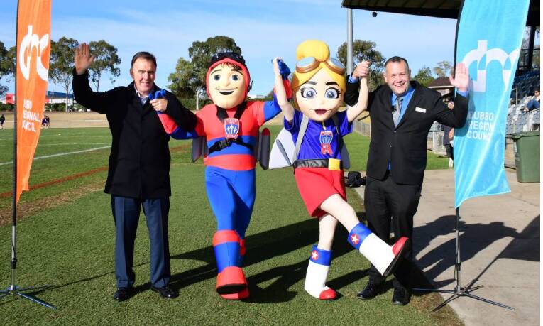 Big game: Newcastle Jets CEO Lawrie McKinna and our mayor Ben Shields, with a couple of friends, jump for joy over the Jets' pending game in Dubbo. PHOTO: BELINDA SOOLE.