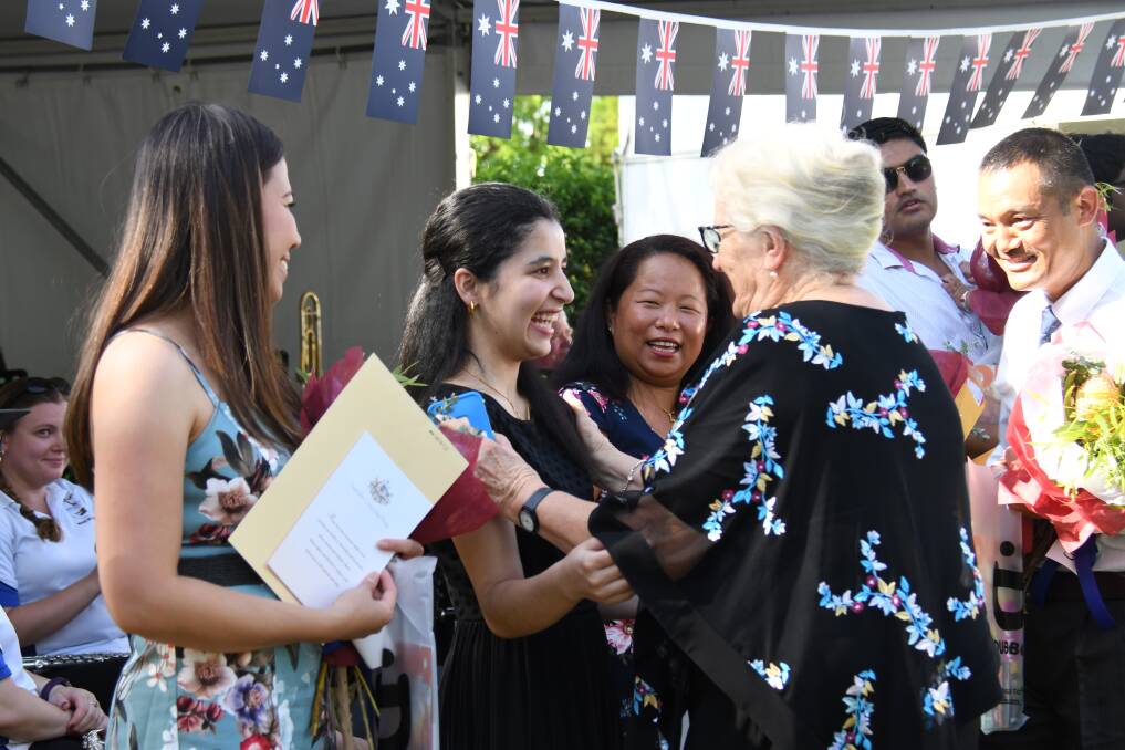CONGRATULATIONS: Senior Citizen of the Year Sue Hill embraces new citizen Swazi Sharma at Dubbo's Australia Day ceremony. Photo: AMY MCINTYRE.