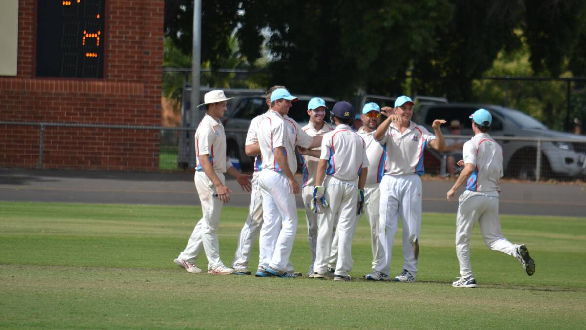 Winners are grinners: Happy scenes from last summer when the Rugby Cricket Club were victorious on grand final day.