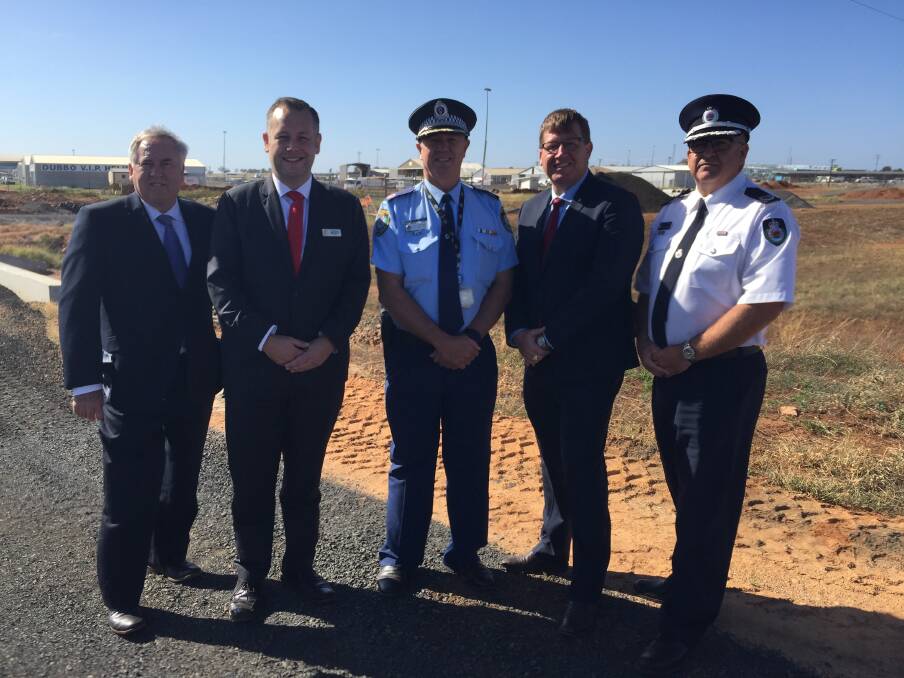 TOP GUNS: Michael McMahon, Ben Shields, Geoff McKechnie, Troy Grant and Peter McKechnie at Dubbo airport where a new police training facility will be. Photo: CRAIG THOMSON.