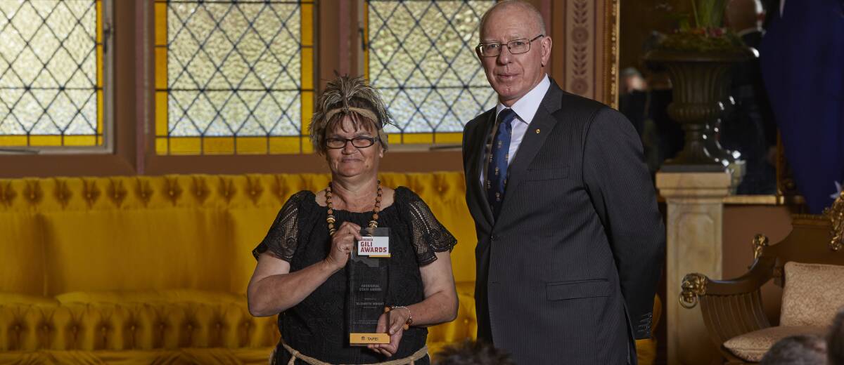 Dreaming and teaching: Dubbo TAFE teacher Elizabeth ‘Aunty Beth’ Wright received her 'Gilli' award from Governor of New South Wales General David Hurley.