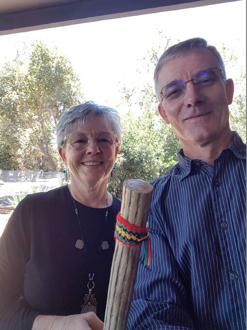 PRAYING FOR RAIN: Kath and Terry Skinner with one of their most treasured possessions, the Rainstick.