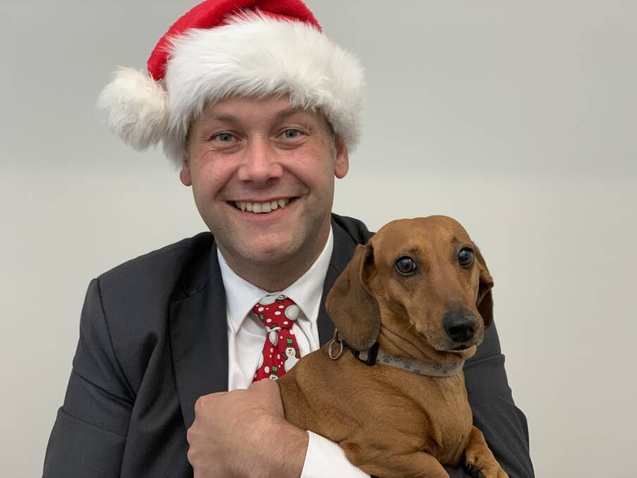 PAWFECT: The mayor with Charlie the Dachshund, who he found under his Christmas tree four years ago. PHOTO: SUPPLIED.