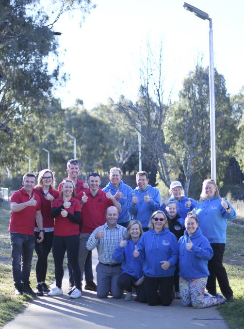 Well-Lit: Red Jumpers - Titan Macquarie Mud Run Committee, Blue Jumpers - Dubbo Stampede Committee with DRC Open Space Co-coordinator Ben Pilon.