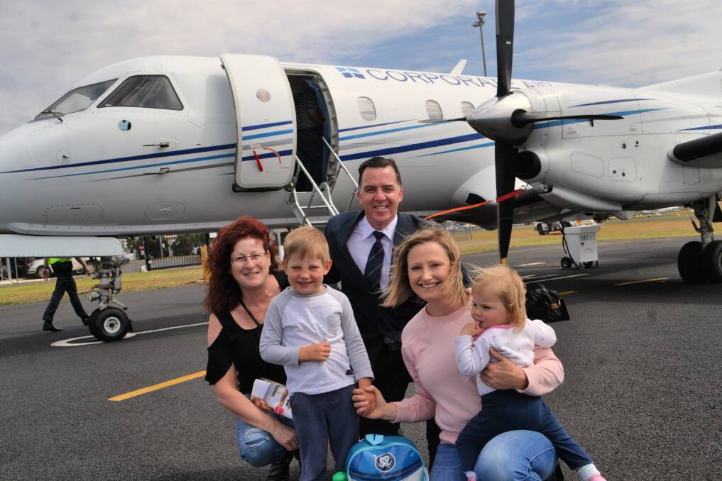 Come fly with me: Fly Corporate's Geoff Woodham with happy passengers Catherine Newin, Kristen Hart and her children. Photo: Craig Thomson.