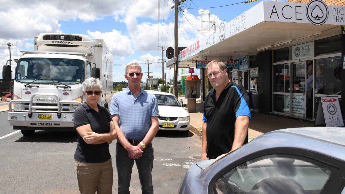 Kath Skinner, Terry Skinner and Greg Freeman say an RMS plan to take shopfront parking away was put to them as a fait accompli. Photo: BELINDA SOOLE.