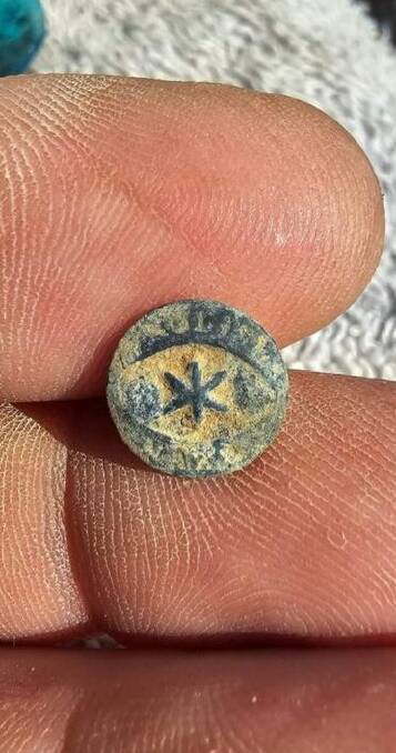 A trinket found at a dump site in Lightning Ridge, which history buff Peter Glogauer claims to be historically significant. Picture supplied