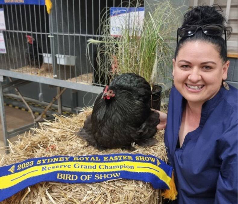 Dubbo Poultry Club secretary Rachel Condon with a Pekin she raised at her home in Brocklehurst, which went on to win the second-highest honour a chook can achieve - Reserve Grand Champion Bird of Show at the Sydney Royal Easter Show 2023. Picture supplied