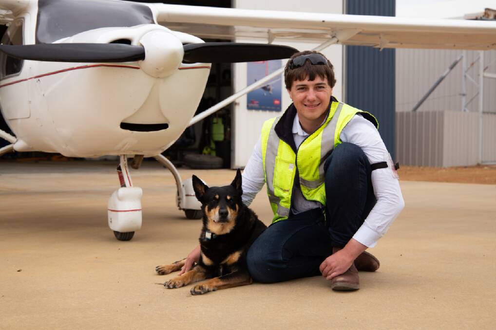 Hayden McDonald, an autistic pilot who created Wings Without Barriers, is pictured in front of his plane with his dog. Picture supplied