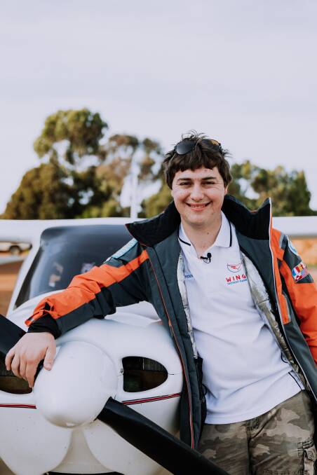 Hayden McDonald, an autistic pilot who created Wings Without Barriers, is pictured in front of his plane. Picture supplied