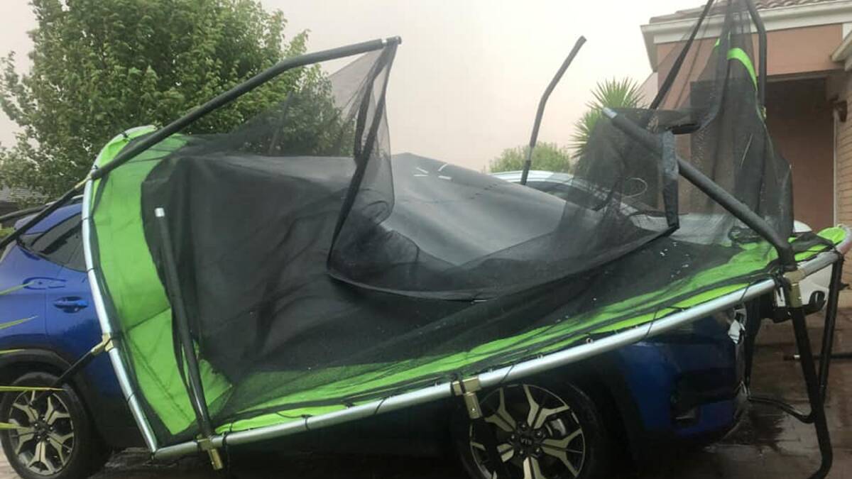 A trampoline is blown onto a car during last night's severe thunderstorm in Dubbo. Picture by Helen Pearce/Facebook