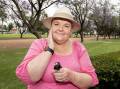Sally Everett, Narromine resident and director of the Australian Skin Cancer Foundation, applies sunscreen in Victoria Park, Dubbo. Picture by Belinda Soole