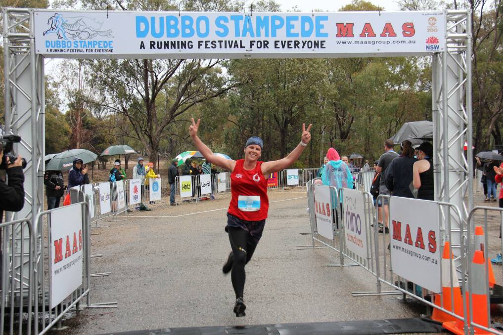 Give back: A Dubbo Stampede participant celebrates completing the course through the Taronga Western Plains Zoo, and raising money for local projects. Picture: CONTRIBUTED
