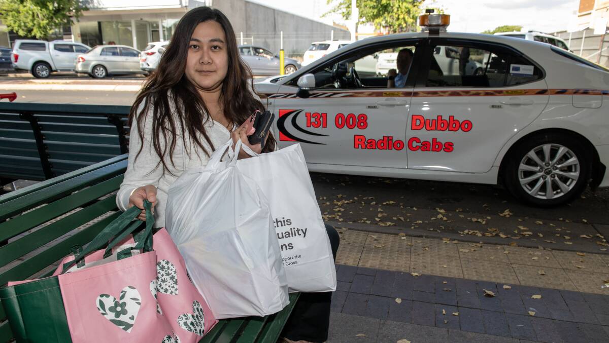 Akire Pawika from Sydney waited for an hour for a taxi in Dubbo. Picture by Belinda Soole