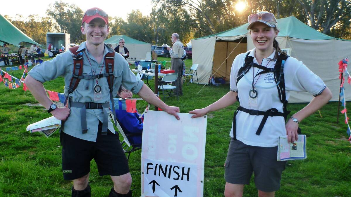 Adrian Anderson (left) at the finish line of a rogaining event. Picture supplied