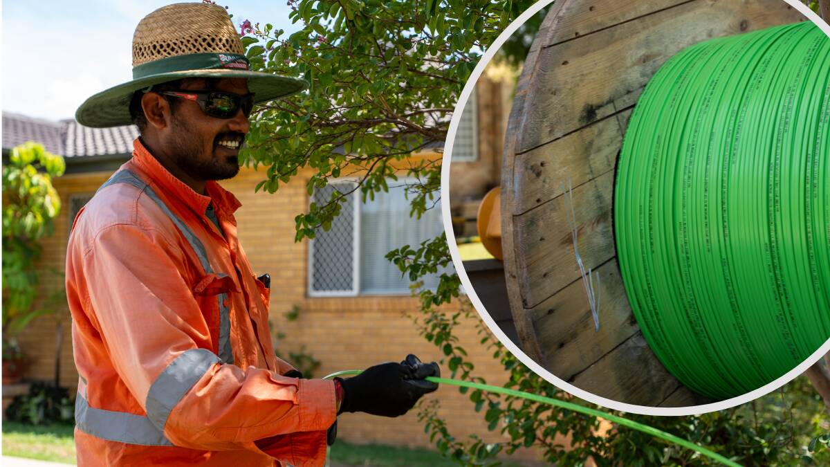 Nbn workers installing full fibre technology outside an Australian home. Picture supplied