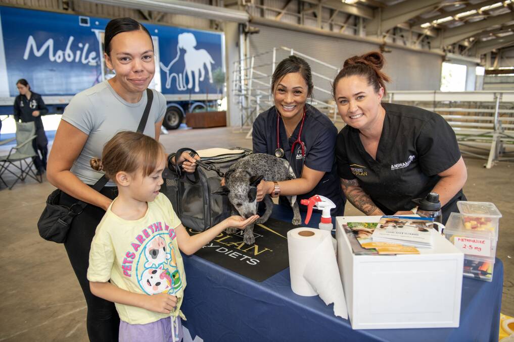 Mahalia and Ella-Grace Doolan with puppy Willow, alongside vet Charlen Carig, and vet nurse Sandra Hartley, at the AWL mobile vet truck in Dubbo. Picture by Belinda Soole