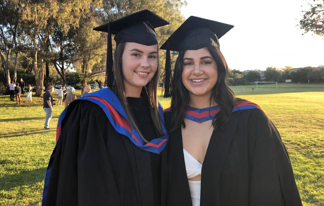 Back on campus: Laura Gilmore and Emily Eagleston returned to Charles Sturt University's Bathurst campus this month to celebrate their postponed graduation. Picture: CONTRIBUTED